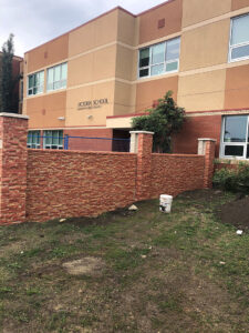 Exterior painting of brick for Edmonton School